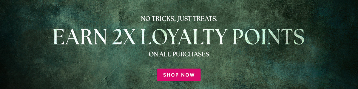 Moody green textured banner reading “No tricks, just treats. Earn 2x loyalty points on all purchases.” with a pink Shop Now button.